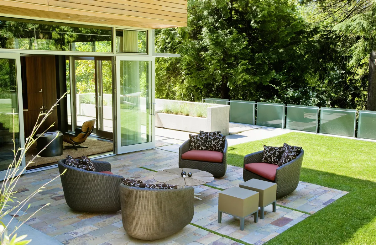 Modern patio landscape design in Glenshaw, PA by Sorce Landscaping – Featuring stylish outdoor seating, natural stone pavers, and lush greenery. Create a relaxing outdoor living space with expert patio and landscape design services.